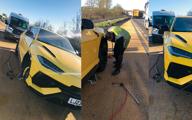 Technician fitting a tyre